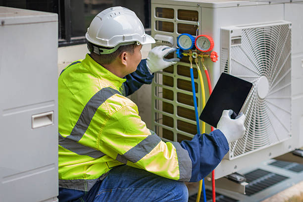 Professional Heat Pump Repair technician working in Arlington, IN